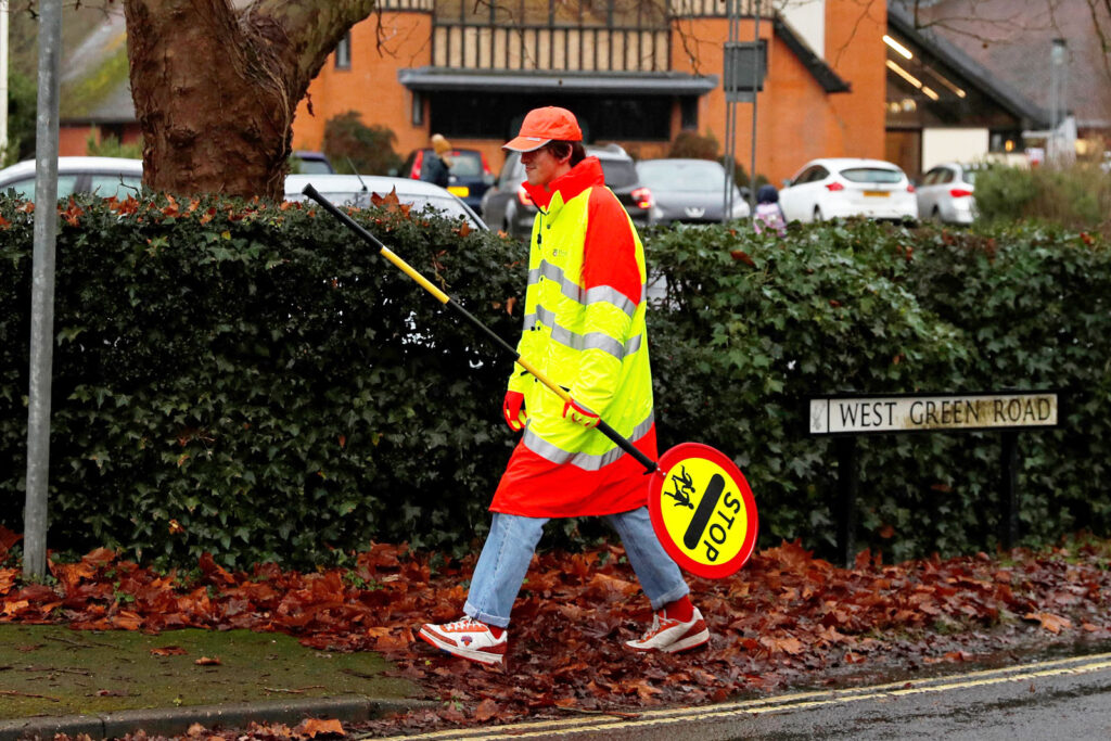 Families rally against cuts to lollipop crossings