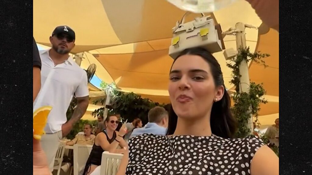 Kendall Jenner Parties in Saint-Tropez With K Handbag on Her Head